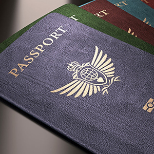 blue, green, burgundy passports fanned out on a table