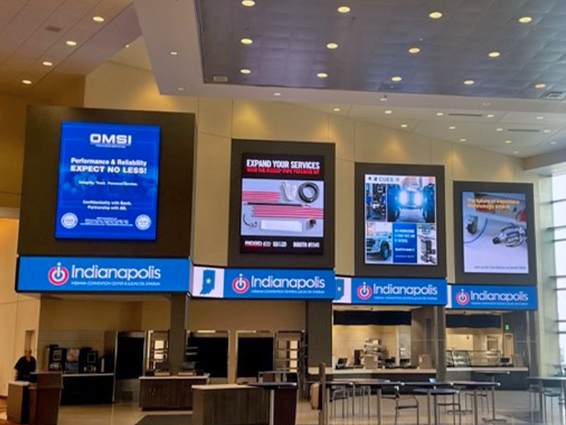 Digital banners above the food court counters at the convention center