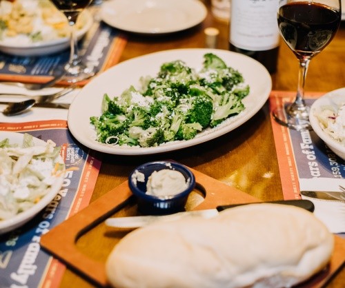 Indianapolis restaurant with salad, bread, and wine on table