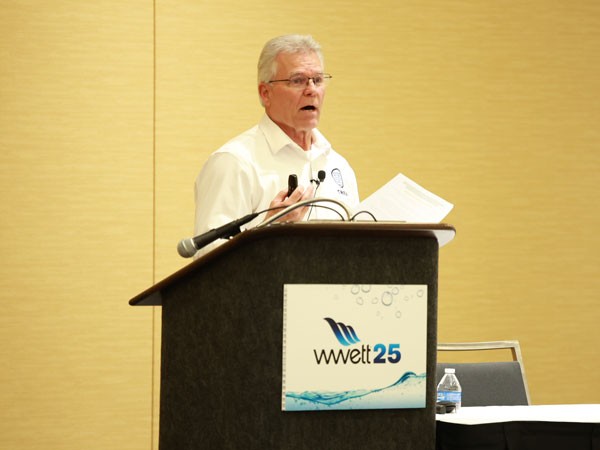 2 Men looking at technology on the WasteExpo show floor