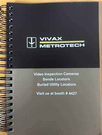 notebook with booth information at WWETT