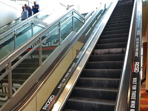Sponsorship logos on outside of escalators in the convention center