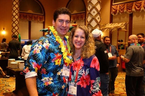 2 people taking a photo together at the WWETT Welcome Party