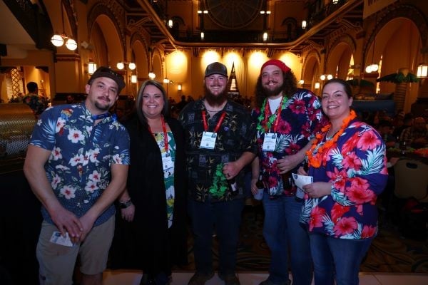 Group posing for picture at the WWETT welcome party