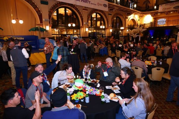 table of people eating at the WWETT welcome party
